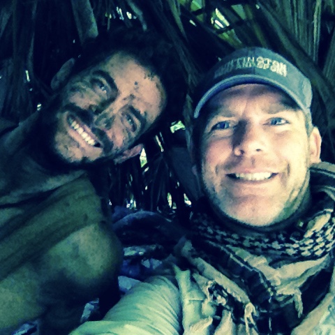 Donny lying down with Steve on the Naked & Afraid shoot
